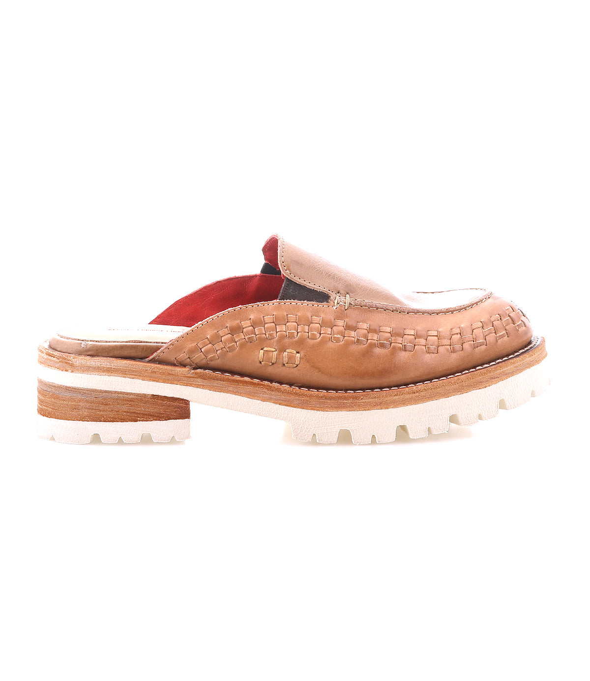 The Bed Stu Fuel is a brown handwoven leather slip-on mule with woven details, a chunky stacked heel, and a lightweight outsole for flexible, secure comfort. Shown in a side view against a white background.