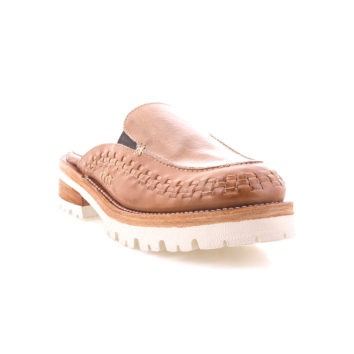 The Bed Stu Fuel is a tan handwoven leather slip-on mule featuring woven detailing, a chunky white lightweight outsole, and a low wooden heel, shown against a white background.