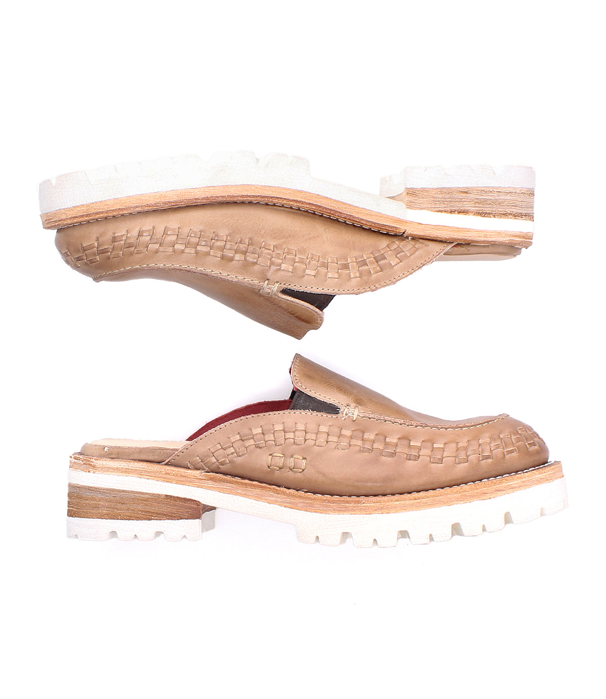 A pair of Bed Stu Fuel tan handwoven leather slip-on shoes with thick white soles, stacked heel, and woven detailing, displayed in opposite directions on a white background.