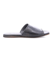 The Bed Stu Gailee is a black leather slide sandal with an open toe, flat sole, and cushioned footbed, shown in a side view against a white background.