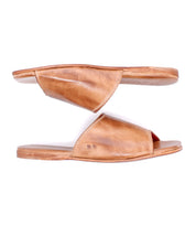 The Bed Stu Gailee sandals feature brown leather slides with a cushioned footbed, displayed side view, one above the other, on a white background.