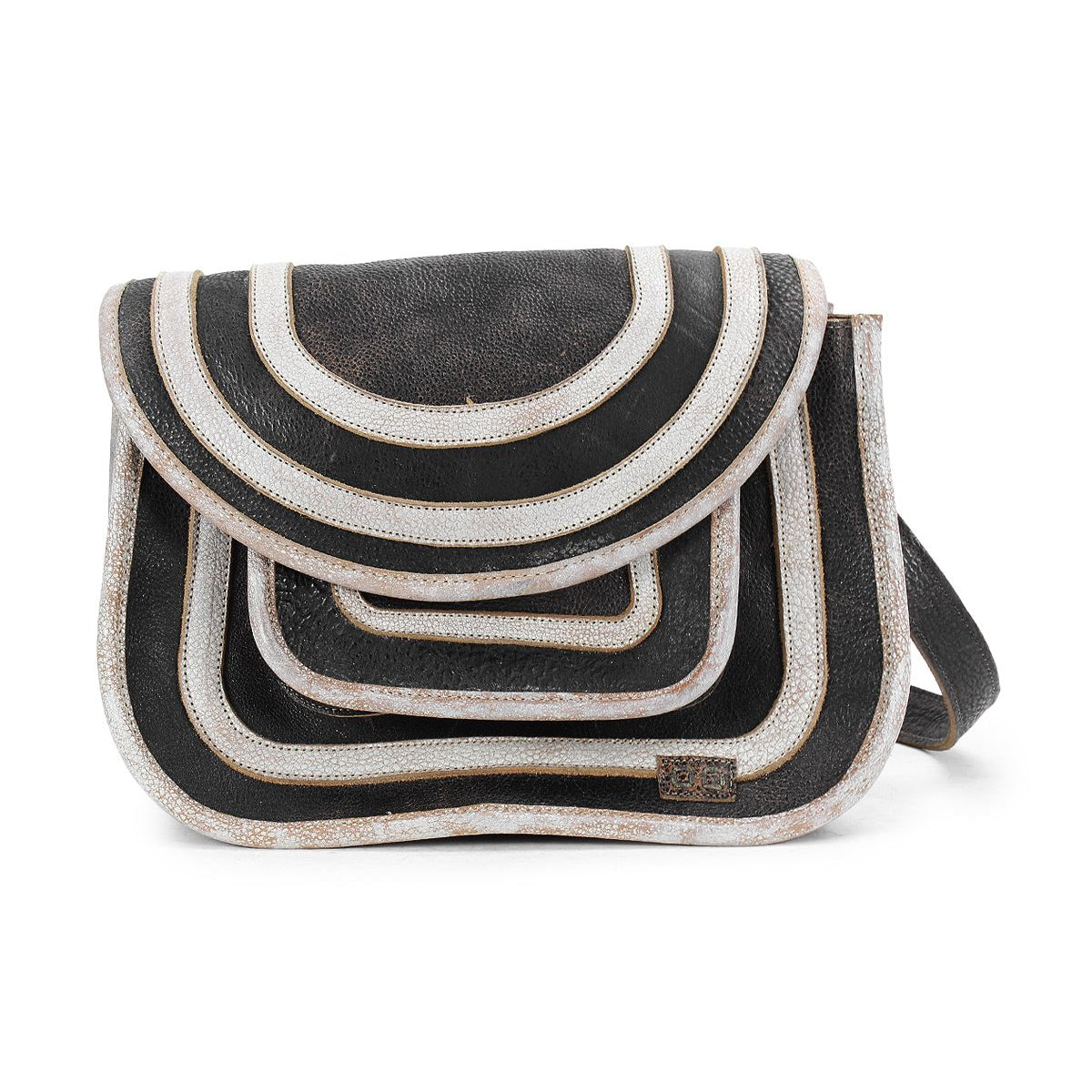 The Gilda by Bed Stu is a black and white, multi-layered crossbody bag with a curved flap design, crafted from dual-finished leather.