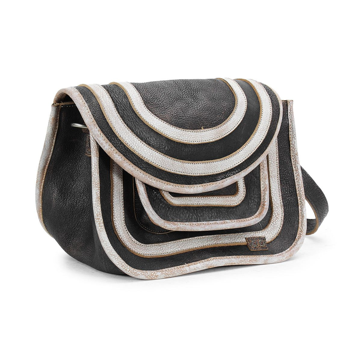 The Gilda by Bed Stu is a black crossbody bag featuring dual-finished leather and layered white and beige arcs on the front flap, forming a striking geometric pattern.