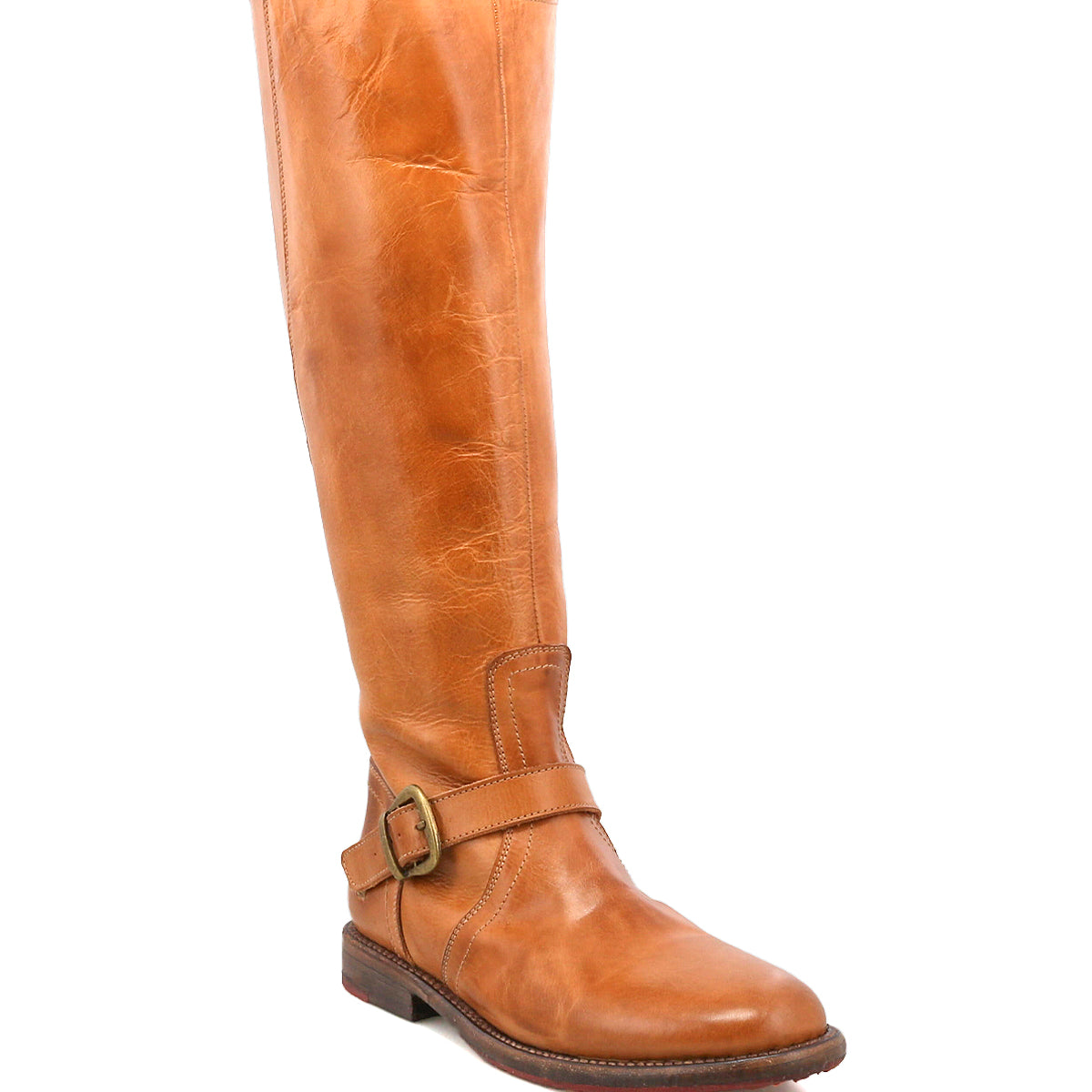 The Bed Stu Glaye is a single tan leather equestrian boot featuring a low heel, round toe, and vintage buckle strap detail, displayed against a plain white background.