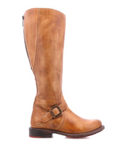 Bed|Stü Glaye Wide Calf tan knee-high leather equestrian boot with a side zipper and a decorative buckled strap at the ankle.
