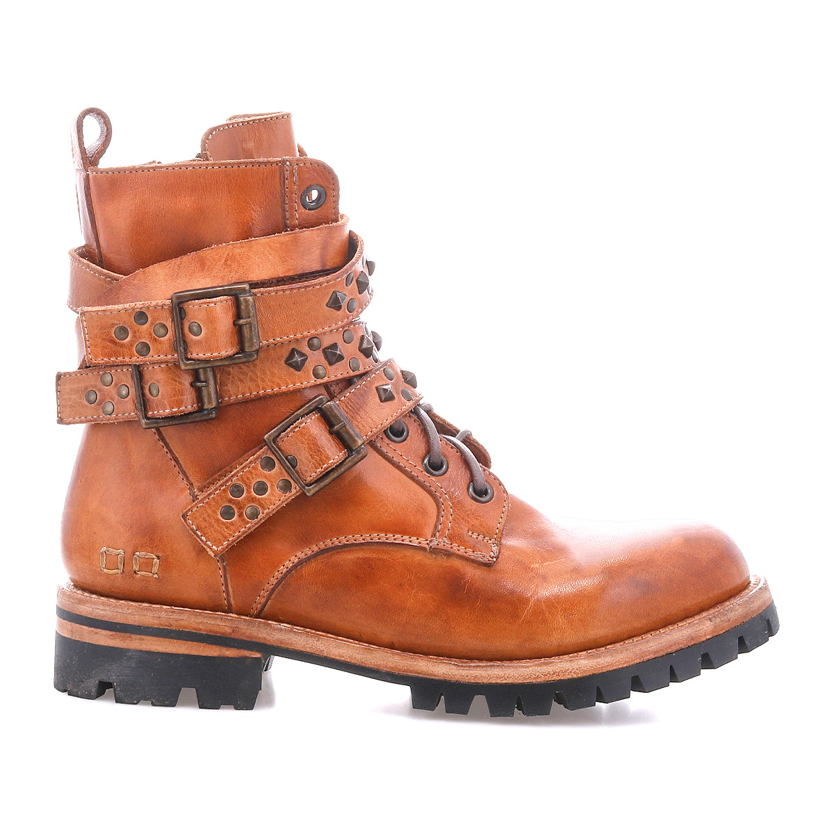 The Bed Stu Grab is a brown leather combat-inspired boot with studded buckle straps, metal accents, a Vibram rubber lug sole, and slight heel, shown from the side on a white background.