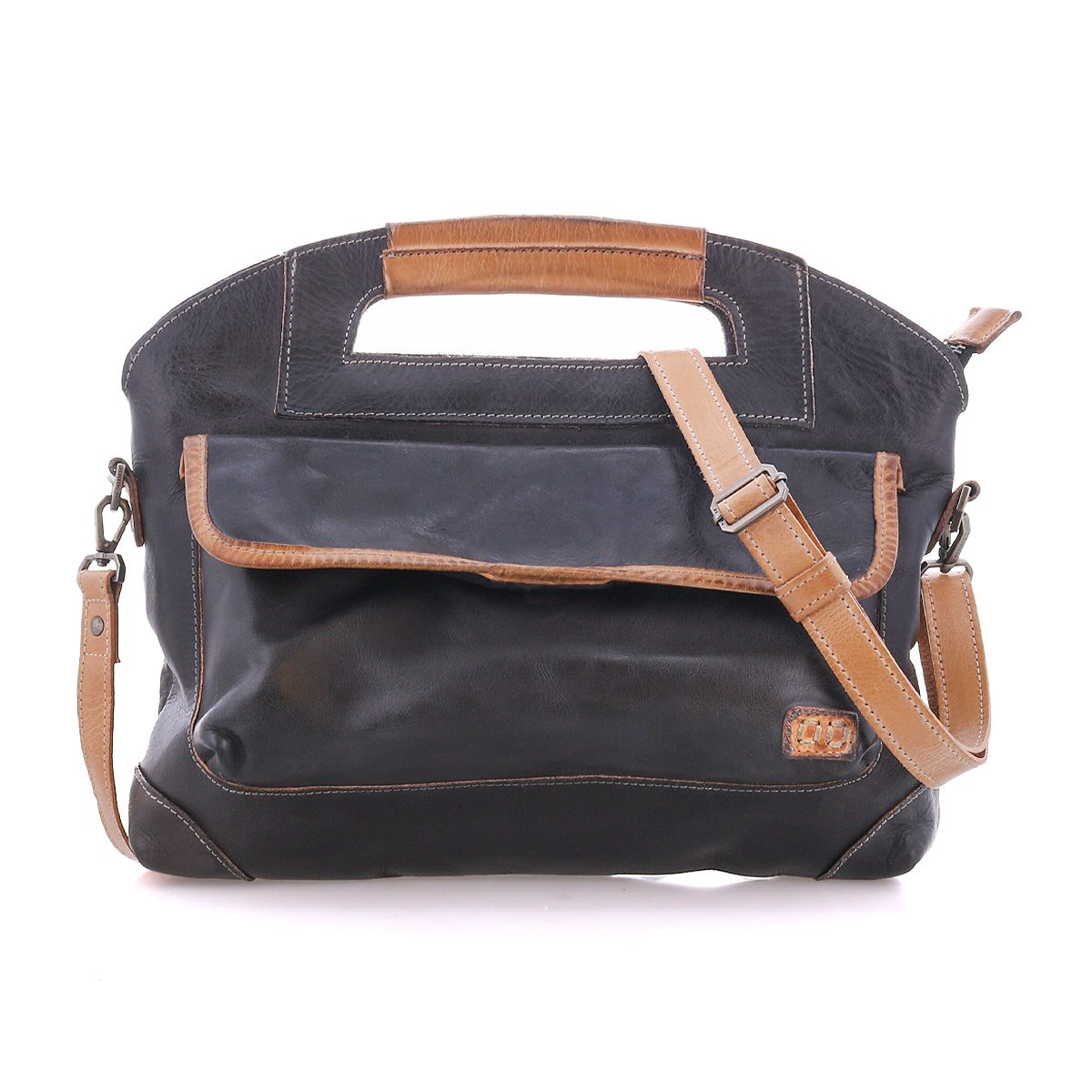 The Bed|Stü Greenway is a black and brown full-grain leather handbag featuring a front pocket, adjustable crossbody strap, built-in handle, and zip-top closure, displayed against a white background.