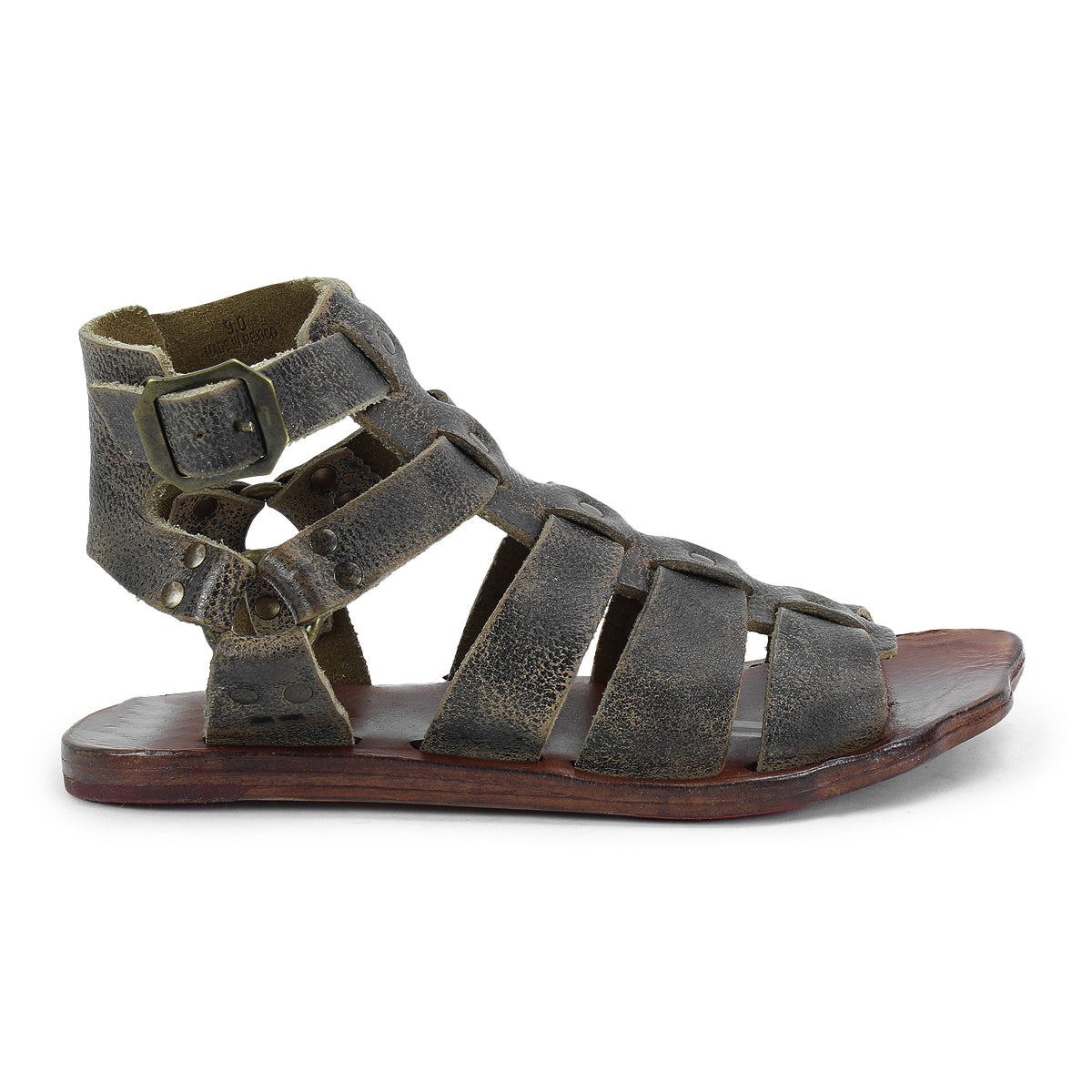 Hera by Bed Stu: Brown strappy gladiator sandals with a flat wooden sole, featuring a side buckle closure, leather outsole, and weathered texture.