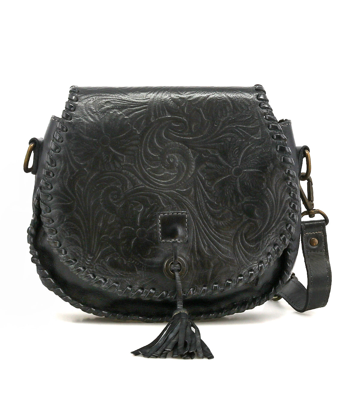 The Bed Stu Half Moon EM is a black leather saddlebag crossbody with an embossed foliage pattern, front flap, braided edges, leather tassel, and adjustable strap.