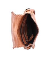 The Bed Stu Half Moon brown leather crossbody purse features visible stitching and is shown from above with the inner compartment zipper partially open.