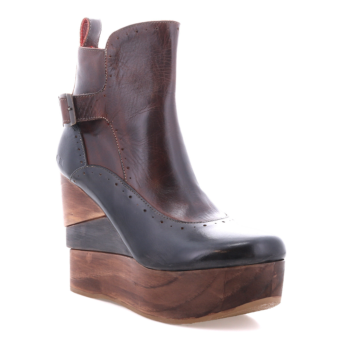 The Harmonious by Bed Stu is a dark brown leather ankle boot with a sculptural wood platform wedge, side buckle, decorative stitching, and a refined leather interior.