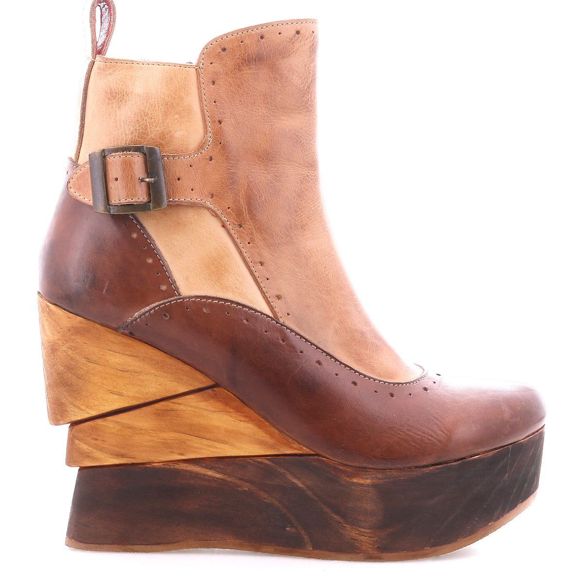 The Bed Stu Harmonious is a brown leather platform wedge ankle boot with a side buckle, a thick sculptural wood wedge heel, and a rich red leather interior.