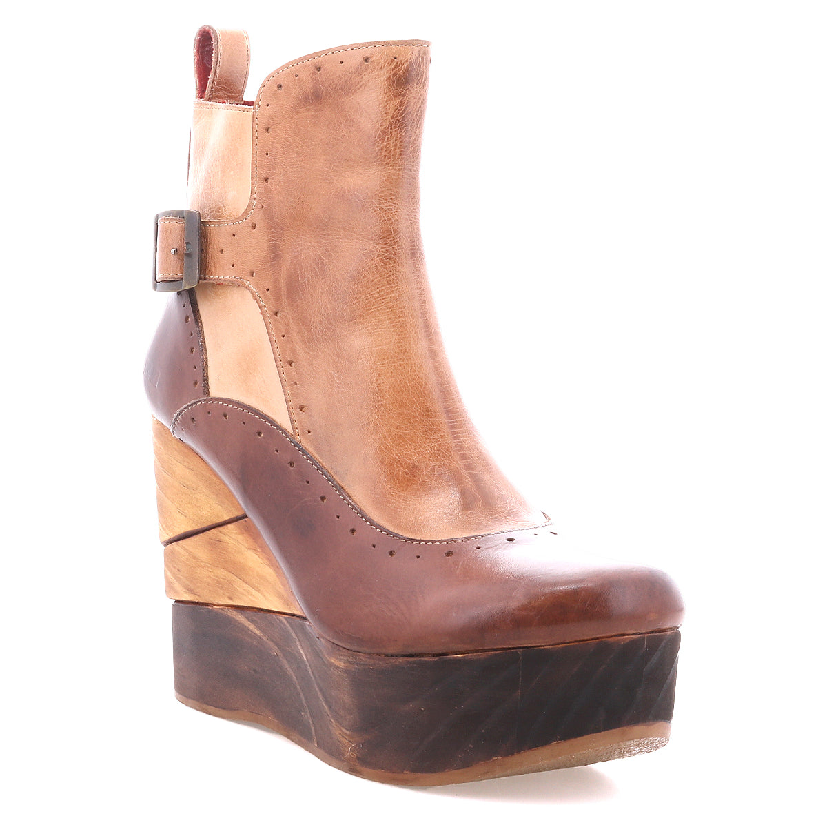 The Bed Stu Harmonious is a brown leather platform wedge ankle boot with a sculptural wood wedge heel, layered wooden platform, ankle buckle, color block details, and red leather interior, shown on a white background.