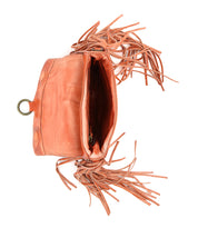 A Bed Stu orange leather crossbody bag features fringe detailing, an adjustable strap, and showcases its spacious interior.