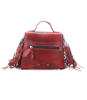 The Bed Stu Hidden is a red leather crossbody bag featuring a top handle, adjustable strap, front zipper pocket, decorative fringe tassels, and metal accents.