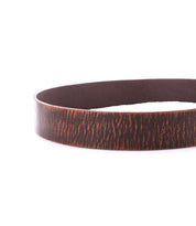 A close-up of the Bed Stu Hobo belt, crafted from brown textured leather, displayed on a white background—a stylish men’s accessory.