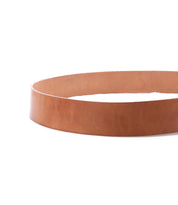 The Bed Stu Hobo is a classic brown leather belt without a buckle, coiled in a loose circle on a white background.
