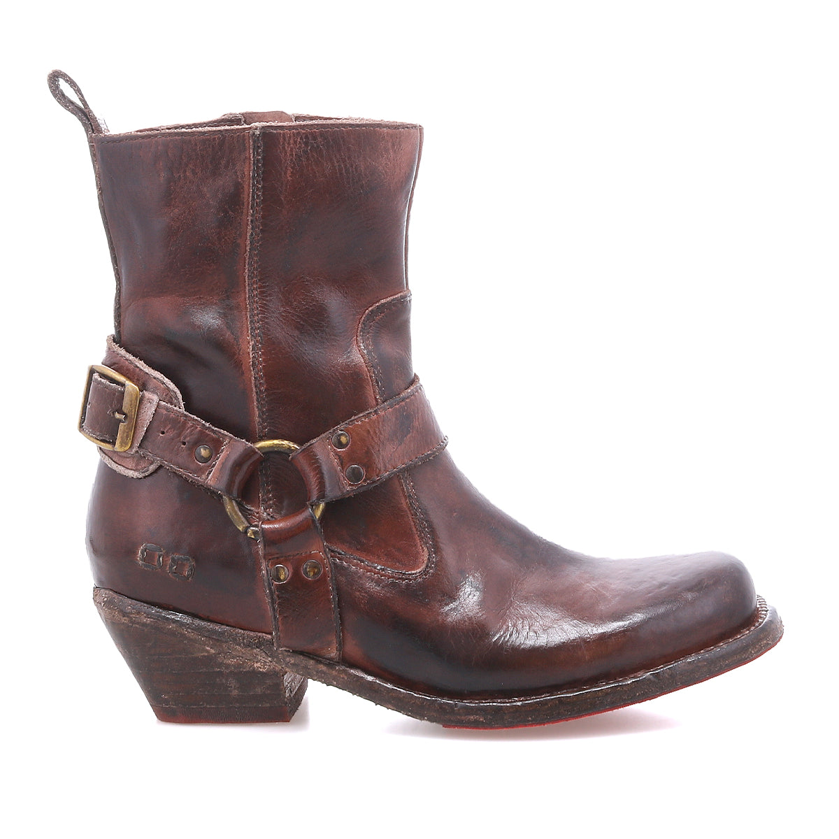 The Bed Stu Homage is a single brown leather harness boot with a low heel, side buckle, and visible wear, shown in profile on a white background.