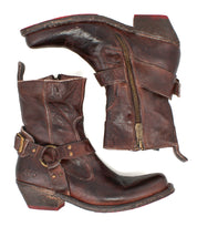 A pair of Bed Stu Homage brown leather ankle boots with side zippers, buckles, and stacked heels, styled in classic men’s fashion, shown side by side on a white background.