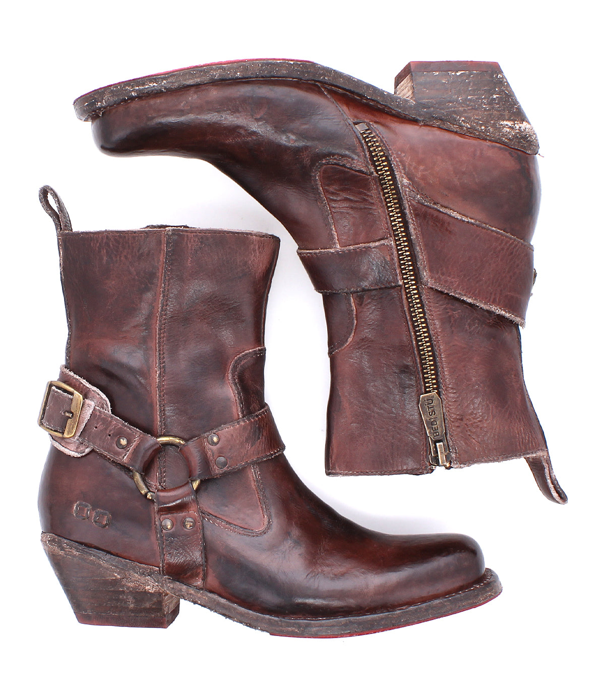 The Bed Stu Homage boots are worn brown leather ankle boots with a square toe, side zippers, buckles, and stacked heels, shown on a white background.