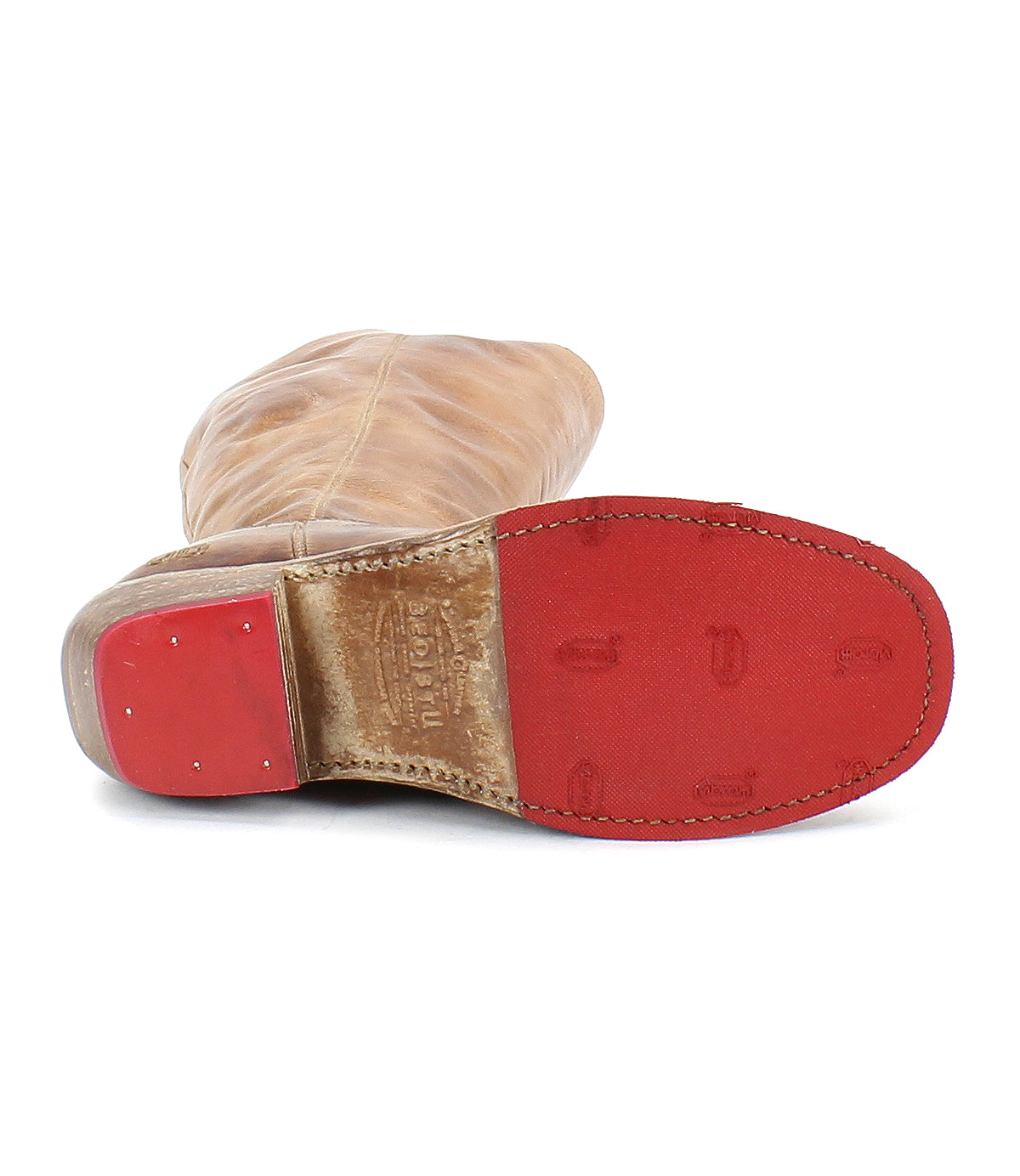 The Bed Stu Humble is a brown leather boot with a red sole and heel, visible stitching, and embossed branding—perfect as a stylish fall/winter boot.