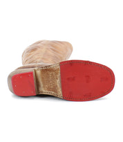 The Bed Stu Humble is a brown leather boot with a red sole and heel, visible stitching, and embossed branding—perfect as a stylish fall/winter boot.