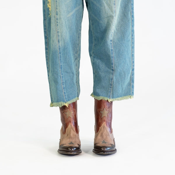 Denim pants with brown black western inspired boots with stars
