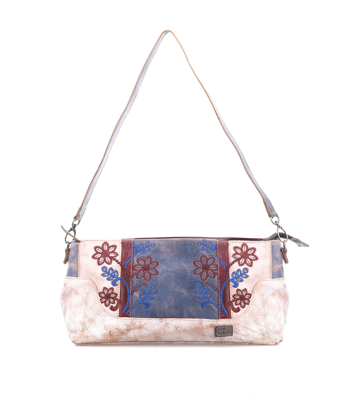 The Bed Stu Hyperbolic is a rectangular bohemian leather shoulder bag featuring beige, blue, and maroon floral embroidery, a brown strap, and a small metal logo plate on the front.