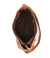Top view of the Bed Stu Hyperbolic, a handcrafted brown leather shoulder bag featuring a spacious main compartment, dark interior lining, and side zipper pocket—perfect for adding bohemian flair to your style.