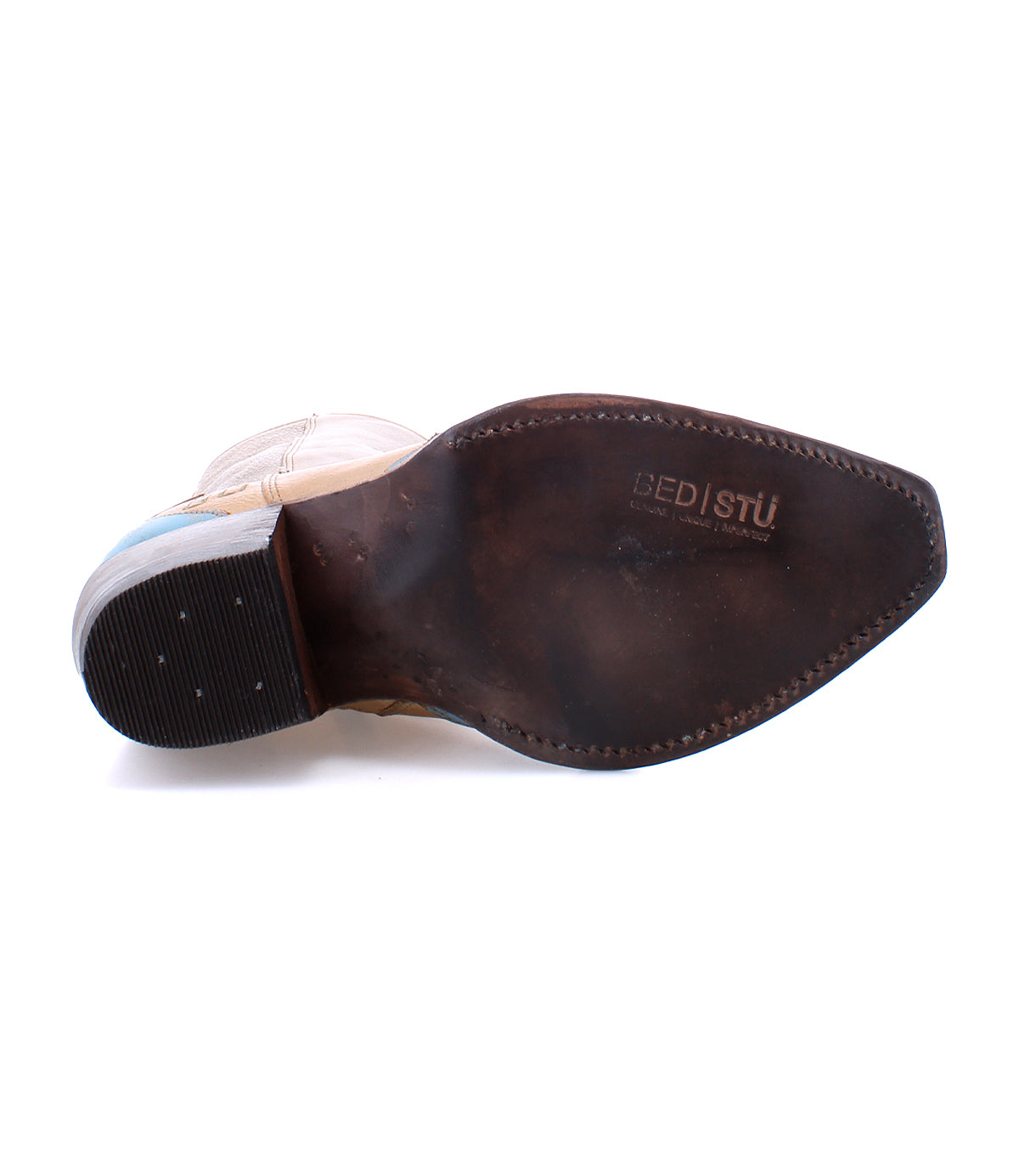 A pair of Hyperspeed handcrafted brown shoes with blue soles on a white background by Bed Stu.