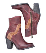 The Bed Stu Iazu boots are handcrafted in brown leather with tan accents, featuring a stacked heel, square toe, and side zippers. Shown on a white background.