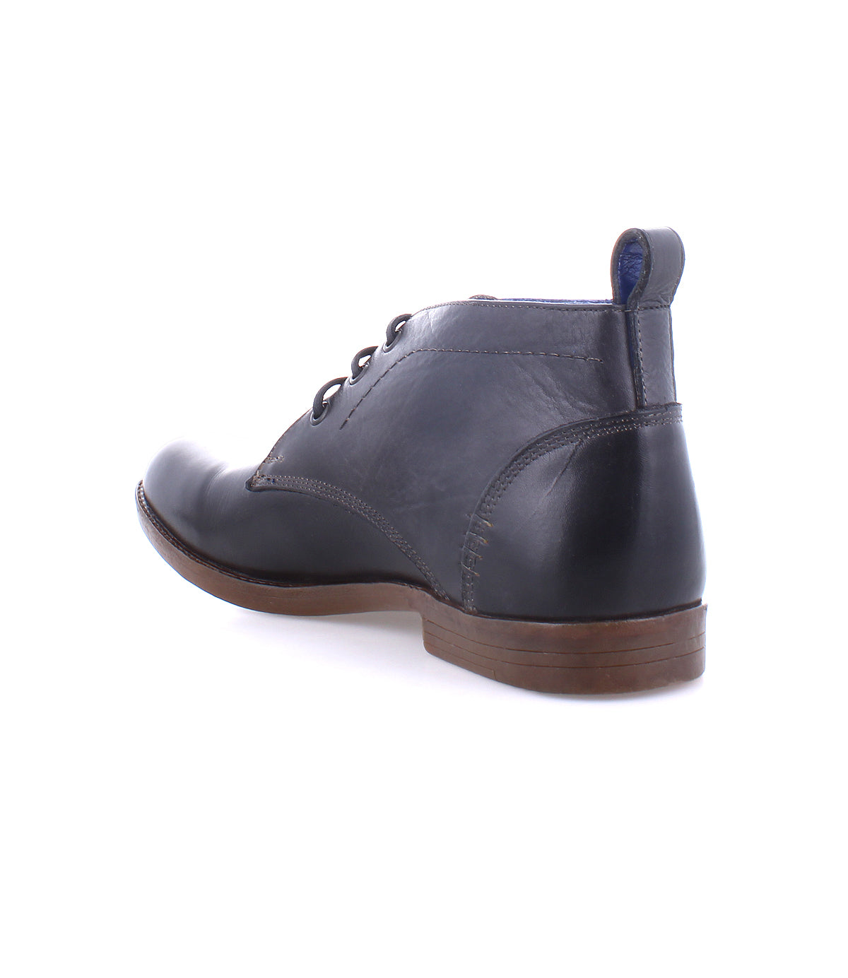 A single Illiad dark navy leather chukka boot with laces and a cushioned insole on a white background by Bed Stu.