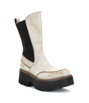 The Illicit by Bed Stu is a single beige and black ankle boot featuring a chunky platform, thick sole, and rounded toe, viewed from a slight angle, radiating a hint of retro flair.