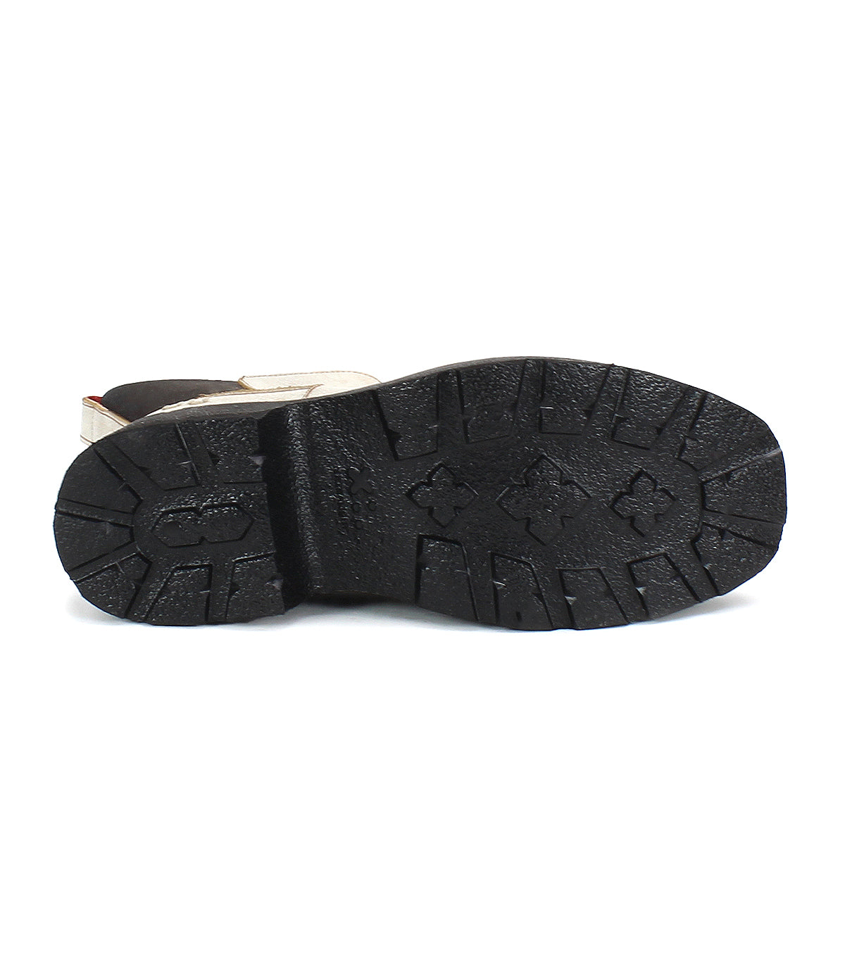 The image showcases the bottom view of Bed Stu's Illicit platform ankle boot, emphasizing its textured black rubber sole with deep treads and a touch of retro style.