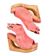 A pair of Imelda wedge sandals with a wooden open-toe design branded by Bed Stu.