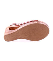 Bottom view of a single Bed Stu 'Imelda' wooden wedge sandal showcasing an open-toe design, textured sole, and a red strap.