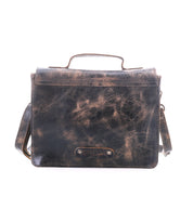 The Bed Stu Improv is a distressed brown leather satchel with a handle, front flap, and adjustable crossbody strap, offering fashion and function. It is showcased against a white background.