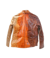 The Bed Stu Include is a handcrafted brown leather jacket featuring varied shades and an orange-tinged center back discoloration—its modern silhouette makes it an ideal statement piece against any white background.