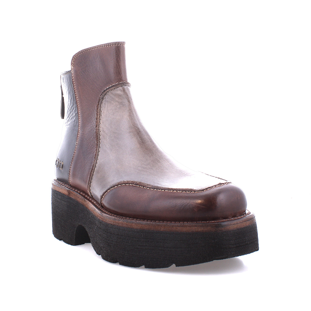 The Infamy ankle boot by Bed Stu features a brown leather design with a rugged, chunky black outsole and visible stitching that highlights its exquisite finishes.