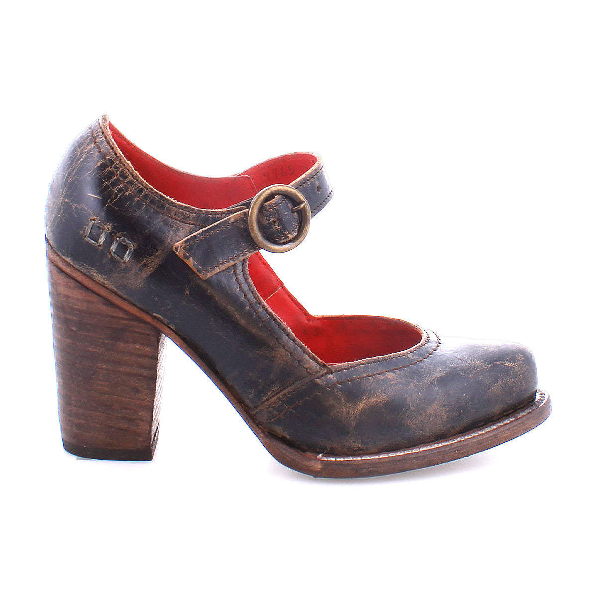 A worn, dark brown Ishtar mary jane pump by Bed Stu with an adjustable strap and block heel, displayed against a white background.