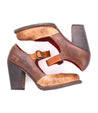 A pair of Ishtar brown leather mary jane pumps by Bed Stu with adjustable straps, viewed from above.