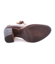 A single Ishtar mary jane pump by Bed Stu photographed from a side angle showcasing the adjustable strap.