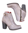 A pair of Bed Stu Isla women's grey leather heeled ankle boots with zippers and a vintage buckle accent.