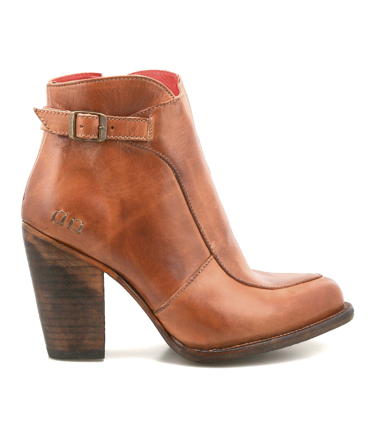 The Isla by Bed Stu is a brown leather bootie featuring a medium-high stacked heel, vintage buckle detail, and delicate stitched accents for a timeless style.
