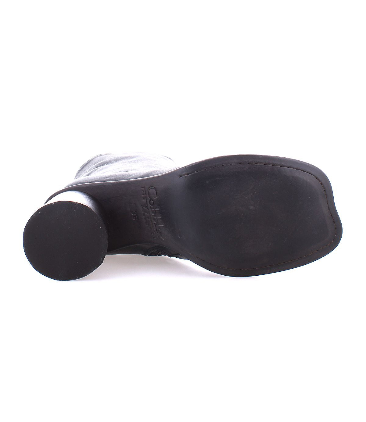 Bottom view of the Isodora shoe by Bed Stu, crafted from black handcrafted leather, featuring a flat sole and round heel.