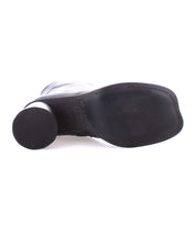 Bottom view of the Isodora shoe by Bed Stu, crafted from black handcrafted leather, featuring a flat sole and round heel.