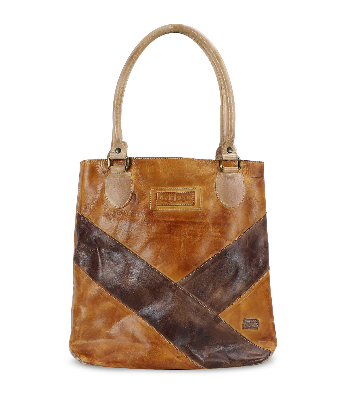 The Italic handbag by Bed Stu features a classic brown leather design with a darker brown diagonal stripe, two beige handles, and a small rectangular logo patch on the front. This spacious tote bag comfortably holds all your essentials.