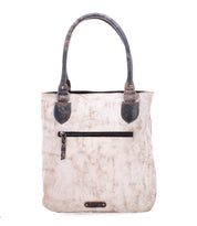 The Italic beige leather tote bag by Bed Stu features a textured finish, two dark handles, a front zipper pocket, and a spacious interior for all your essentials.