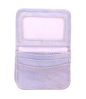 The Bed Stu Jeor is a light purple compact wallet with an ID window, three card slots, and a pocket, shown open against a white background—a versatile accessory for carrying everyday essentials.