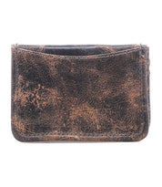 The Bed Stu Jeor is a compact, rustic leather card wallet with visible scuffs and creases, shown front-facing on a white background. It features multiple credit card slots in a slim design.